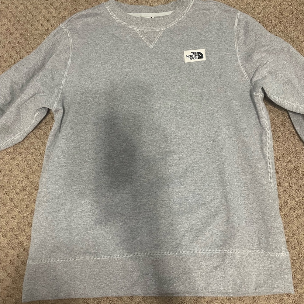 North face hoodie/crewneck and never worn.